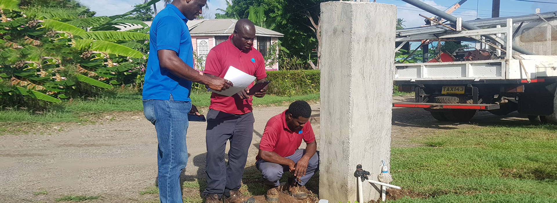 Employees of the Grenadian supplier collect water data.