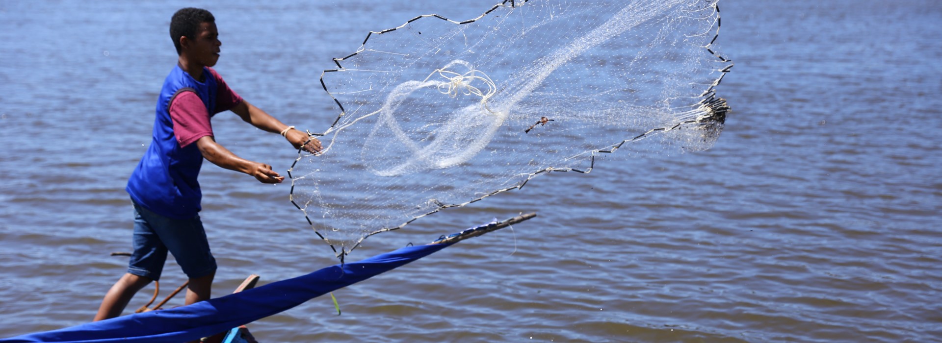 A person holding a net in the air.