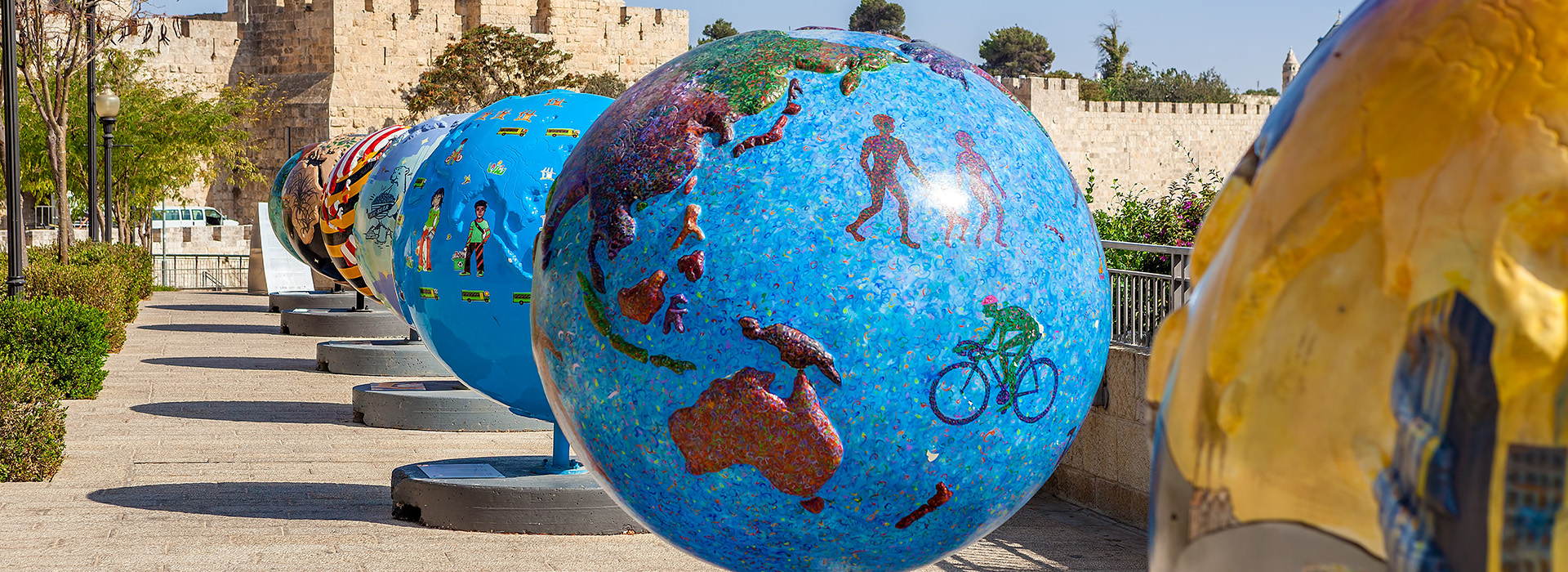 As part of the public art exhibition "Cool Globes" in the Old City of Jerusalem, various statues of globes are exhibited.