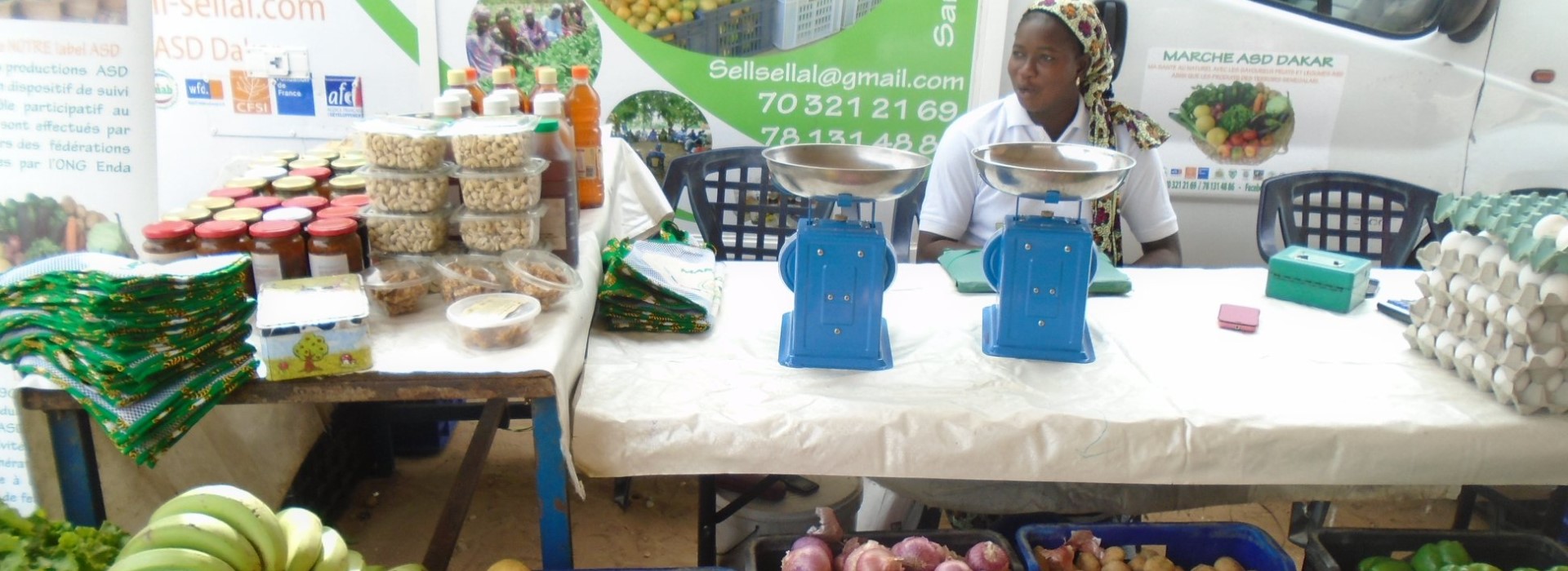 A woman selling food at a market.