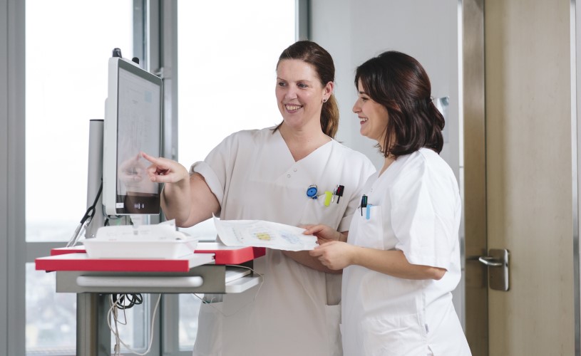 A few nurses in white coats.